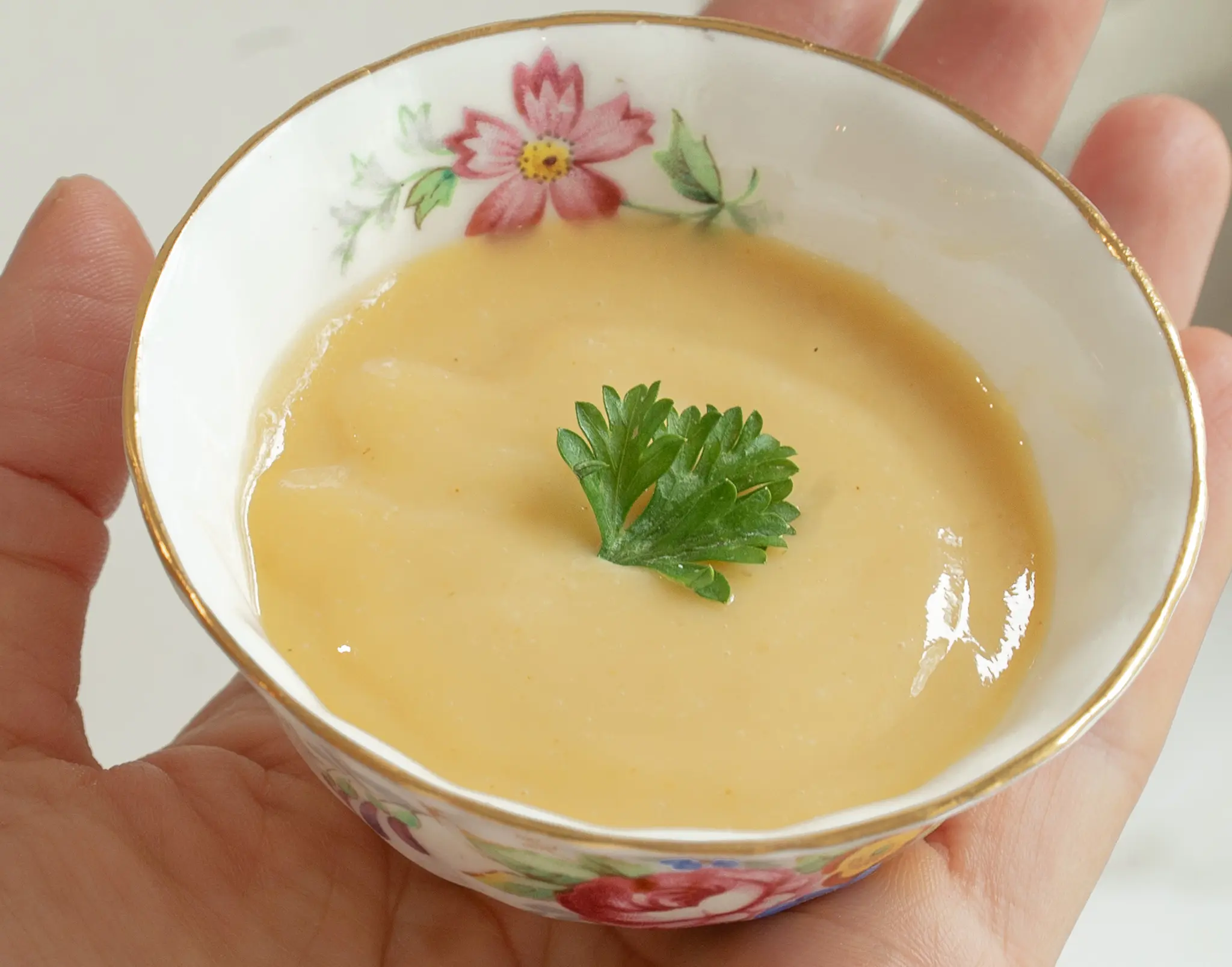 Vintage Bowl of Old-Fashioned Creamy Mustard Sauce in hand