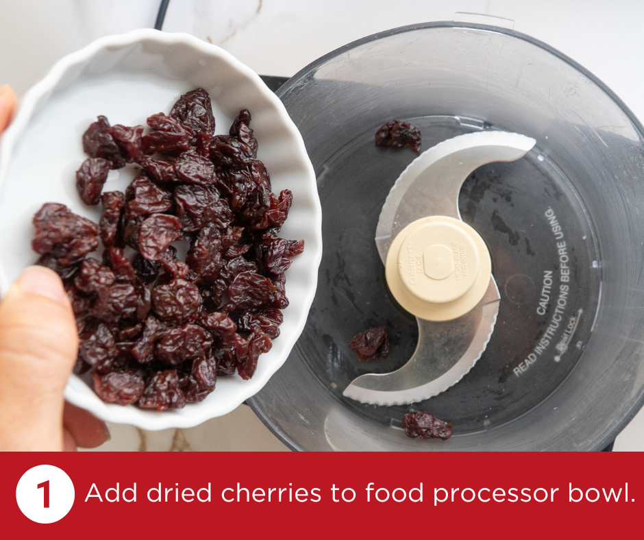 Adding dried cherries to a food processor | PistachioCherryCharmers