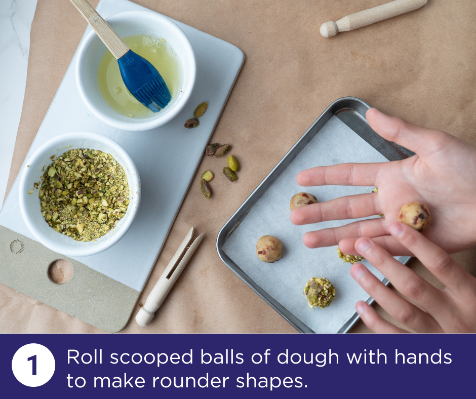 Hands rolling cookie dough into round shape | Cherry Pistachio Charmers Recipe