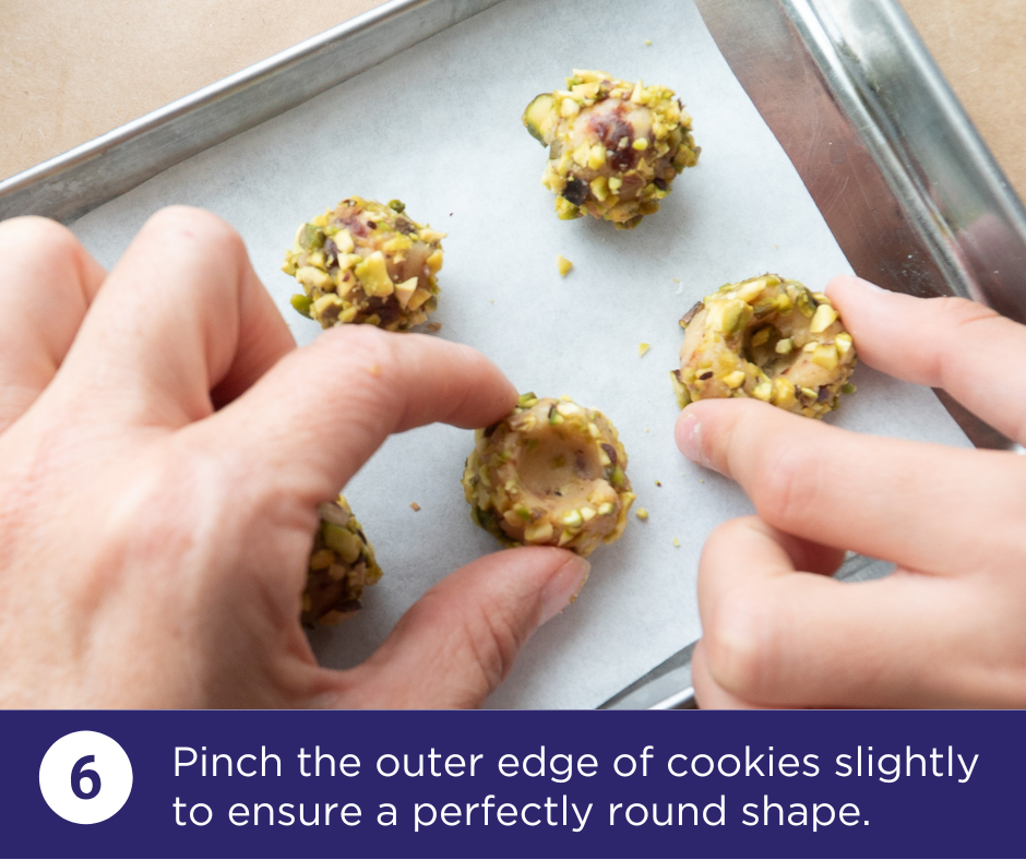 Pinch edges of the cookies to create a perfectly round edge | Pistachio Cherry Charmers Recipe