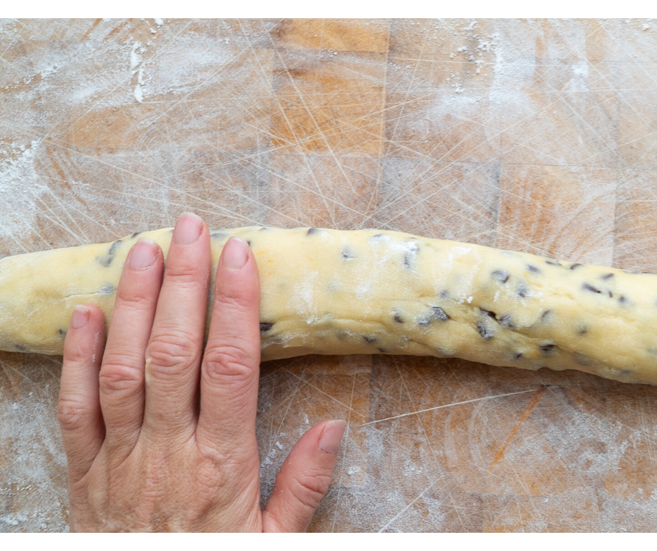 Roll chocolate chip biscuit dough into a log shape