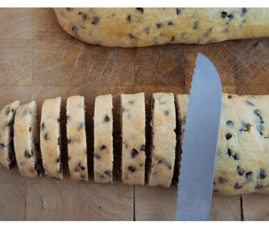 Slicing baked chocolate chip biscuits Slicing baked chocolate chip biscuits