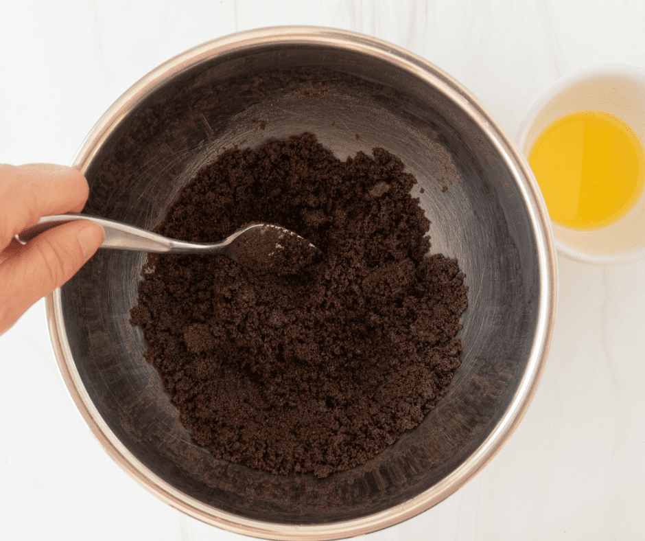 Add Melted Butter to Cookie Crumbs Add Melted Butter to Cookie Crumbs