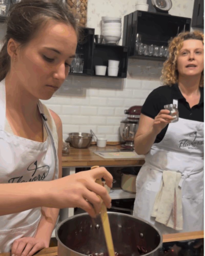 Teen cooking Sour Cherry Soup with Chef Marti during a Hungarian cooking class in Budapest.