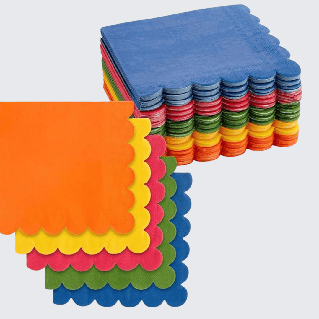 Scalloped rainbow-colored cocktail napkins from Family Tree Foodie, perfect for colorful back-to-school lunches or festive meals.