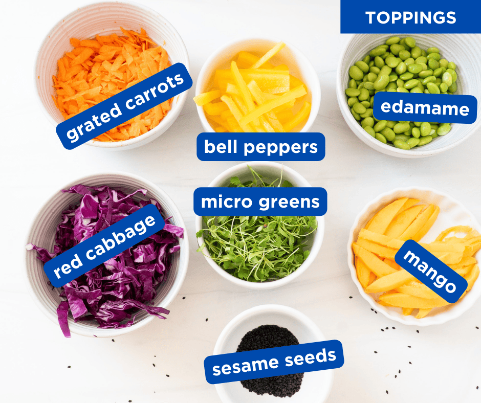 Overhead shot of colorful vegetables and fresh herbs for Thai salmon rice bowls, ready to garnish the dish