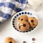 Healthy chocolate chip cookie dough protein bites on a blue and white napkin, ready for snacking