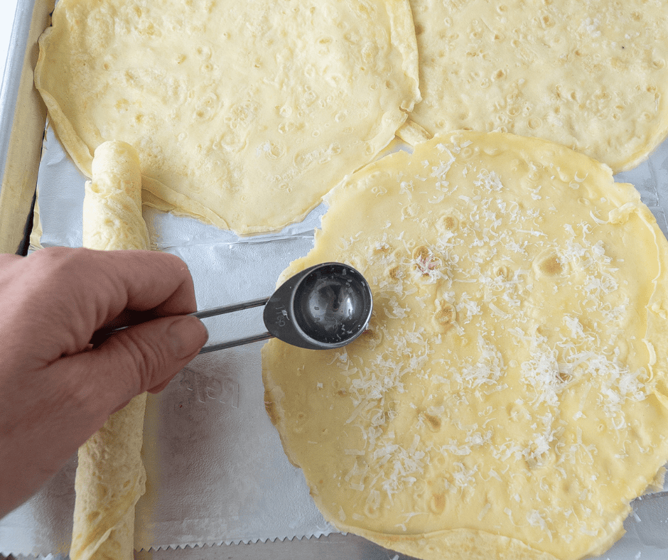 Spreading cheese on crepes 