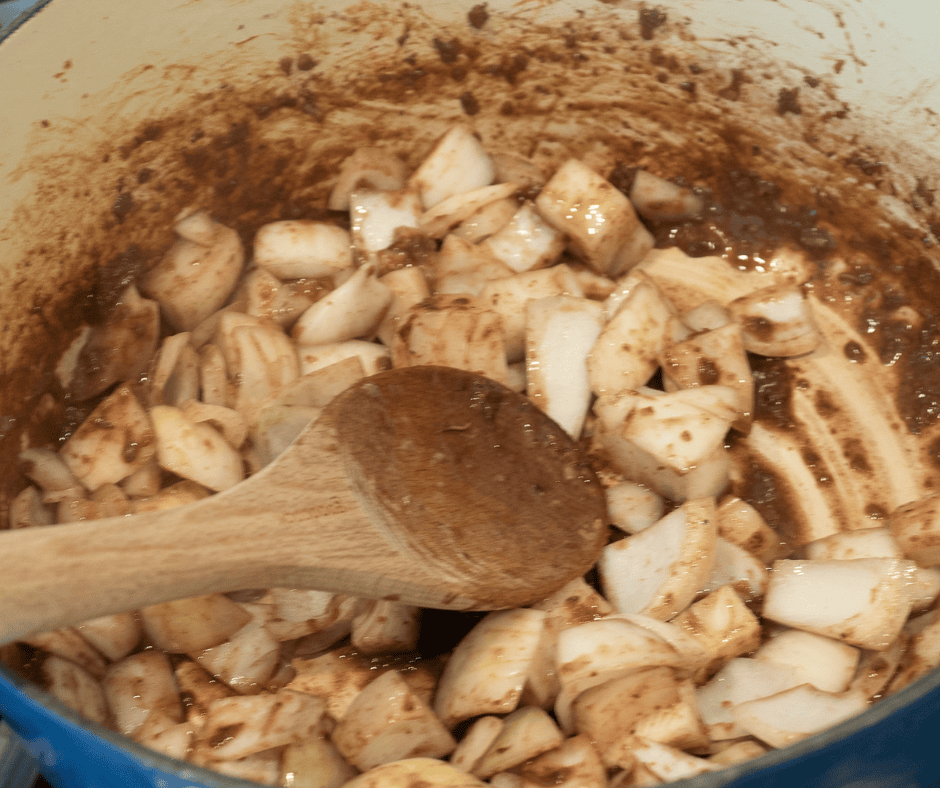 cooking onions in beef broth for beef stew with herb dumplings 