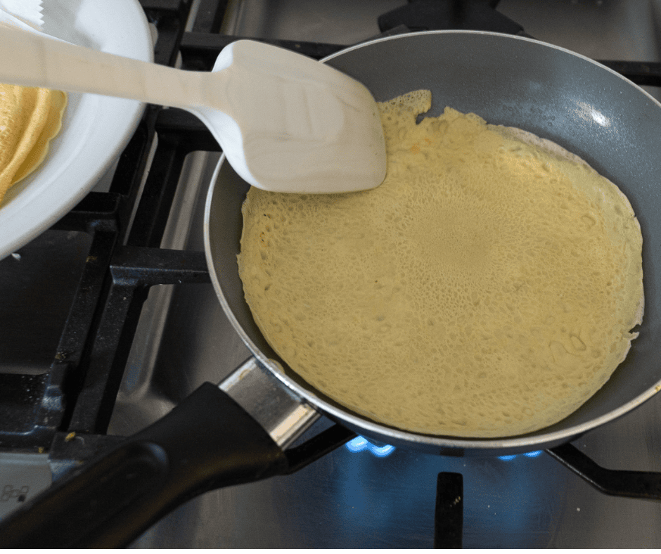 Flipping crepe in pan