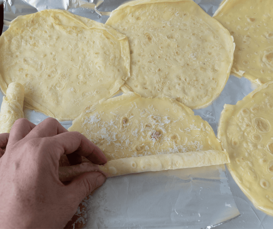 Rolling crepes for Scrippelle ‘Mbusse (Italian crepes in broth)recipe 