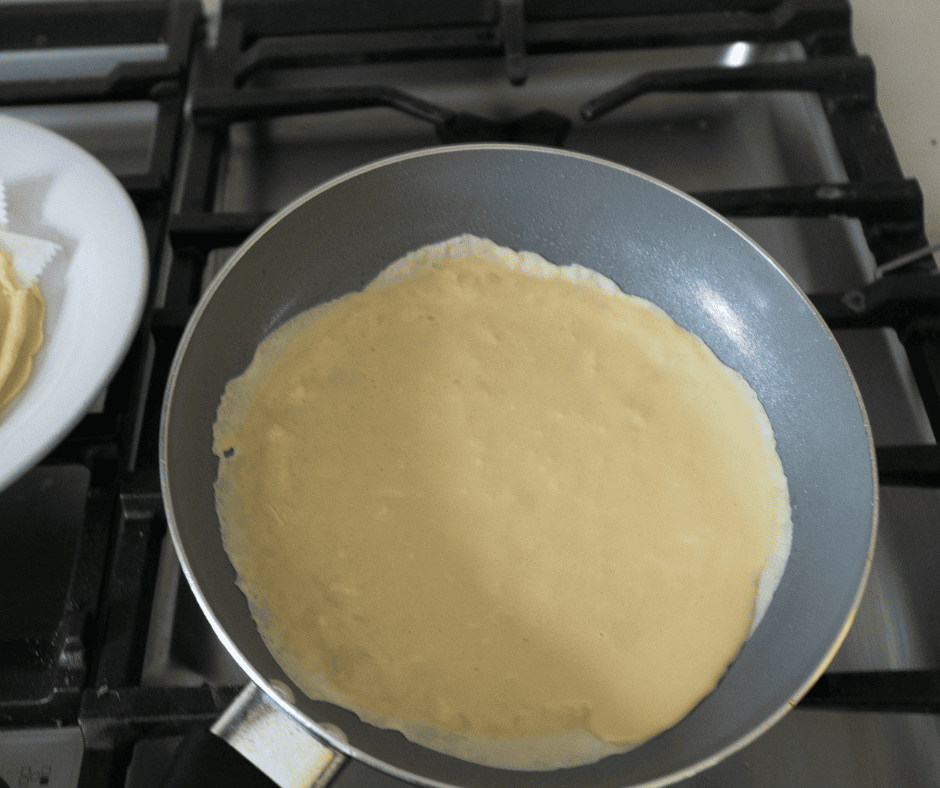 Swirl crepe batter in pan 