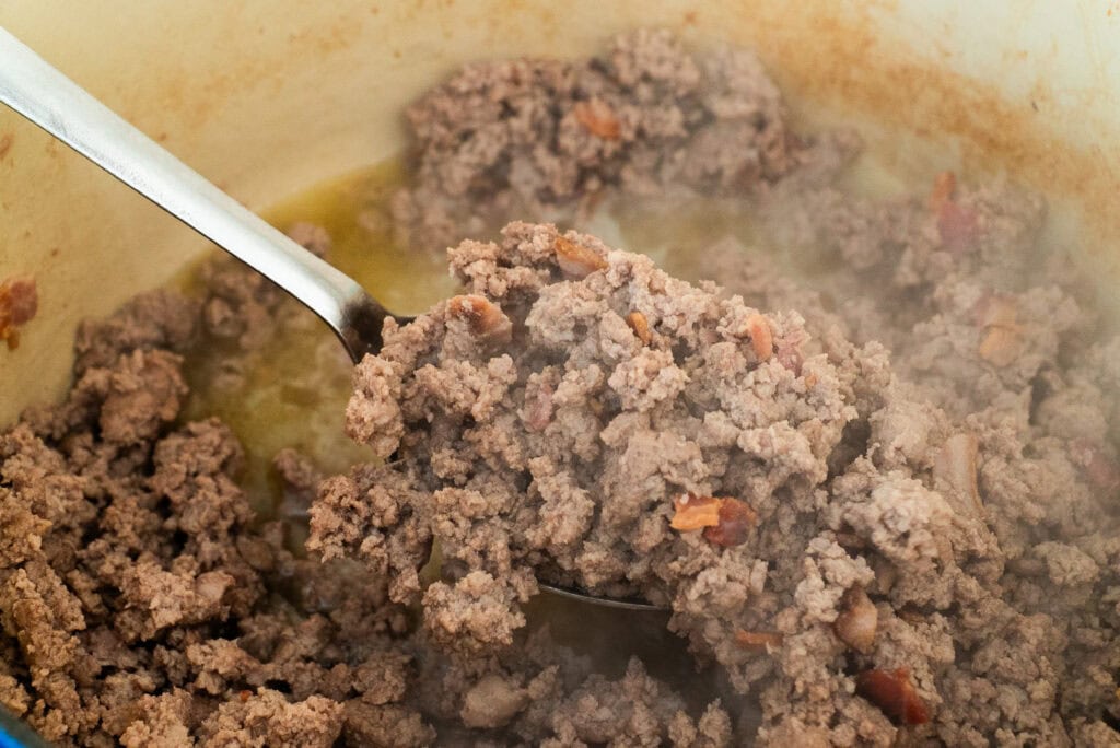 Process shot of ground turkey and bacon cooking for Smoky Turkey Chili