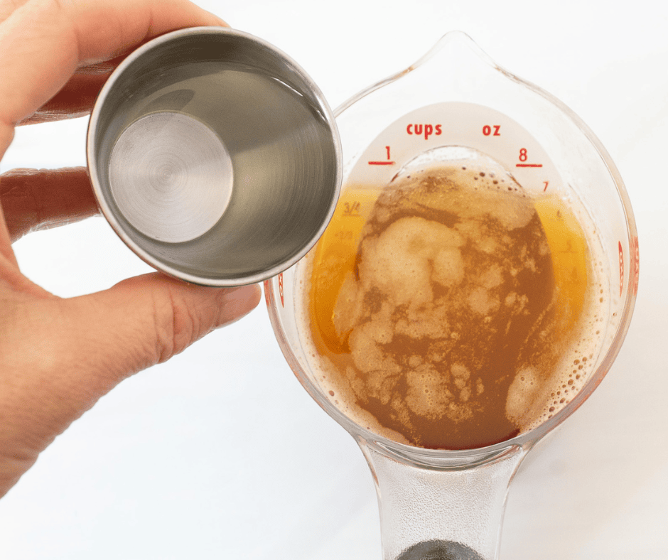 pouring water into brown butter measuring cup